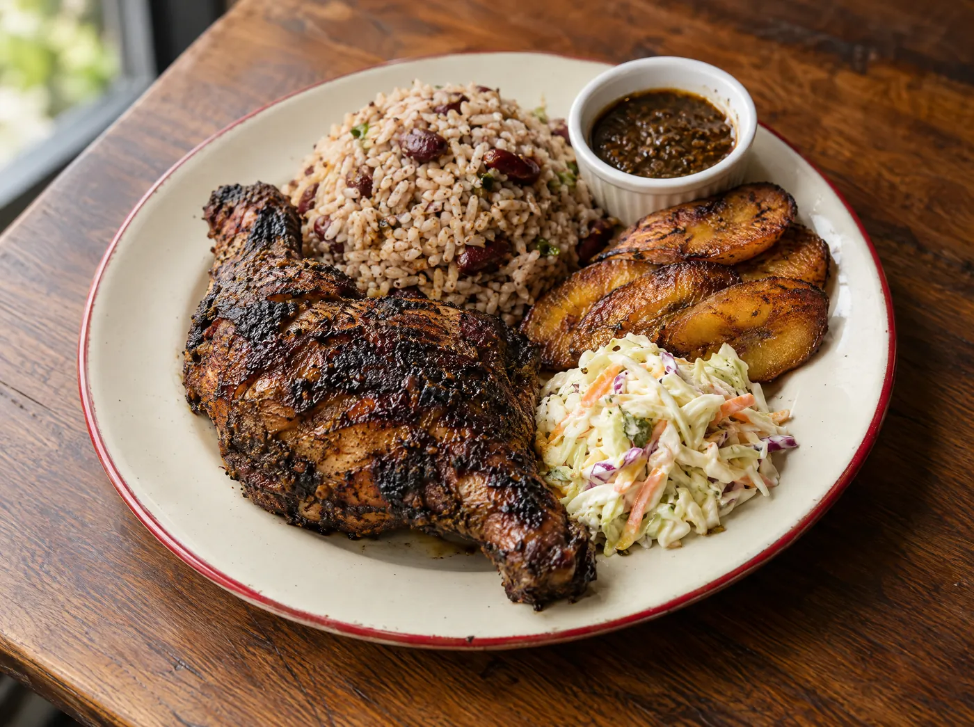 Smoked jerk chicken dinner with rice and peas, plantain and coleslaw